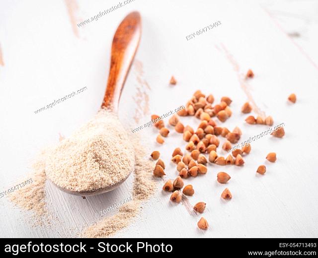 Buckwheat flour and buckwheat on white background Copy space