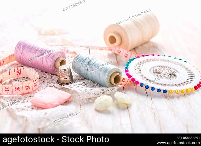Assortment of sewing accessories on white background. Concept of handcraft