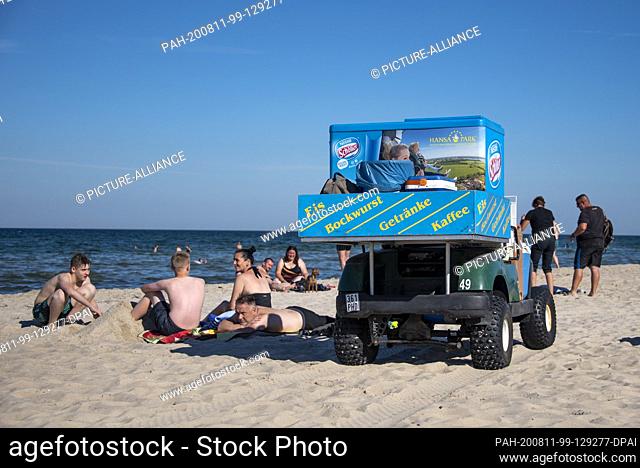 06 August 2020, Mecklenburg-Western Pomerania, Baabe: An ice cream truck drives along the beach. Photo: Stephan Schulz/dpa-Zentralbild/ZB