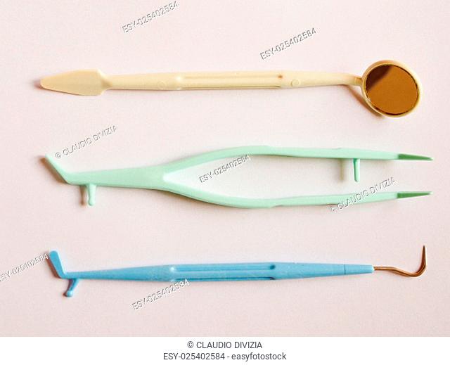Vintage looking Disposable dental instruments tool kit including a mirror probe and tweezers