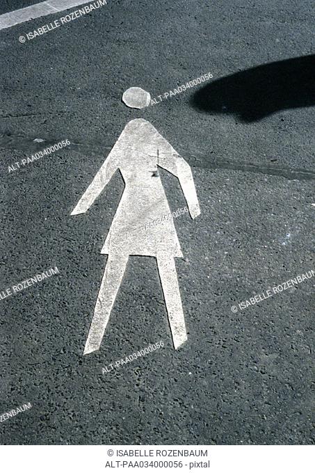 Pedestrian symbol painted on road
