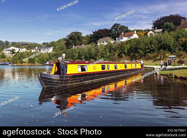 Llangollen, Denbighshire, Wales, United Kingdom. Boats on the Llangollen canal. These craft, known as narrowboats, were designed specifically for the narrow...