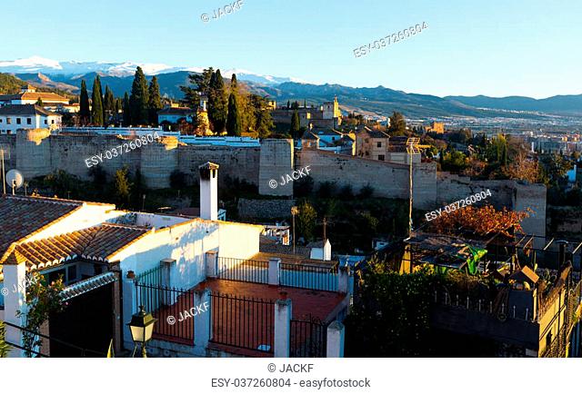 Evening view of Granada with Alhambra and Sierra Nevada in background