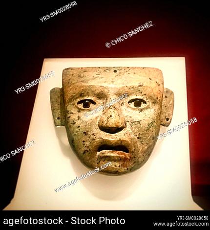 A mask of a human person decorates Templo Mayor museum im Mexico City, Mexico