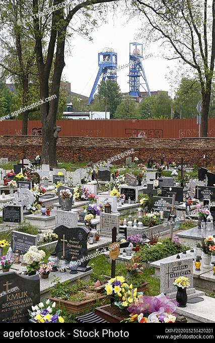 Piekary Slaskie, Silesia, Poland, May 13. View of the Bobrek-Piekary coal mine headframe from the cemetery of the parish of St. Mary and St