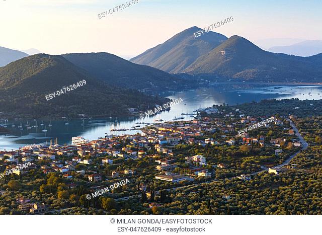 Morning view of Nydri village on Lefkada island with Ithaca and Kefalonia in the distance, Greece.
