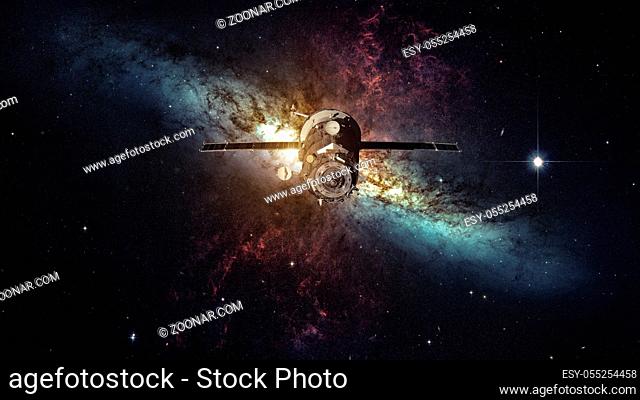 Spacecraft Progress orbiting the space nebula. Elements of this image furnished by NASA