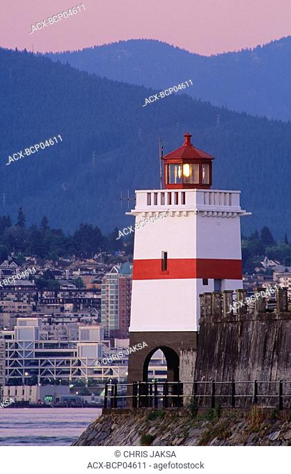 Brockton Point Lighthouse, guides mariners into Vancouver Harbour, North Vancouver and North Shore Mountains in background, British Columbia, Canada