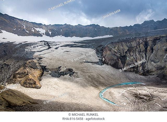 Blue glacial water in a glacier on Mutnovsky volcano, Kamchatka, Russia, Eurasia