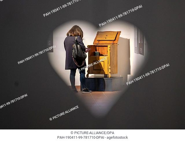 11 April 2019, Hessen, Bad Homburg: A visitor stands in the Saalburg at the press preview of the exhibition ""Drauf schissen! A little cultural history of the...