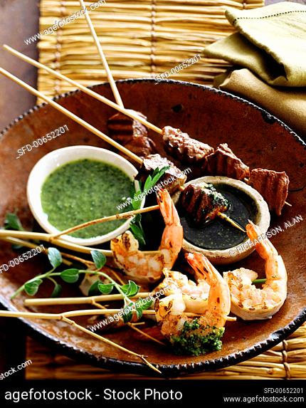 Grilled shrimp and beef kebabs with dips