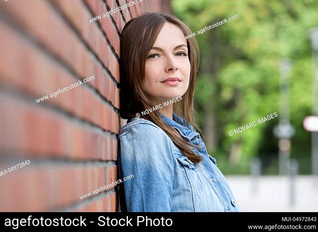 Portrait of a woman wearing a denim jacket
