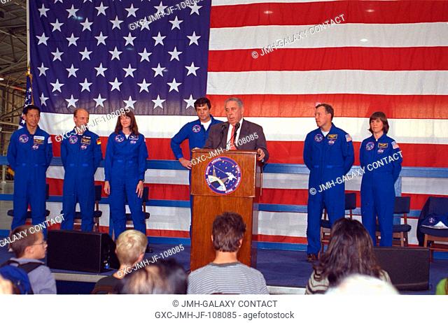 JSC Director George W.S. Abbey introduces the returning STS-99 crew to a large crowd in Ellington Field's Hangar 990 during welcoming ceremonies on February 23