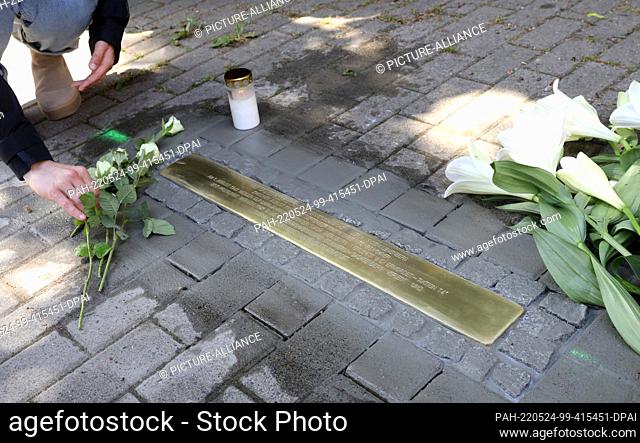 24 May 2022, Mecklenburg-Western Pomerania, Schwerin: A stumbling block by Gunter Demnig, action artist from Cologne, commemorates 290 victims of the Nazi...