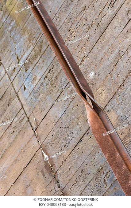 Industrial rusted steel strip and concrete as a background picture