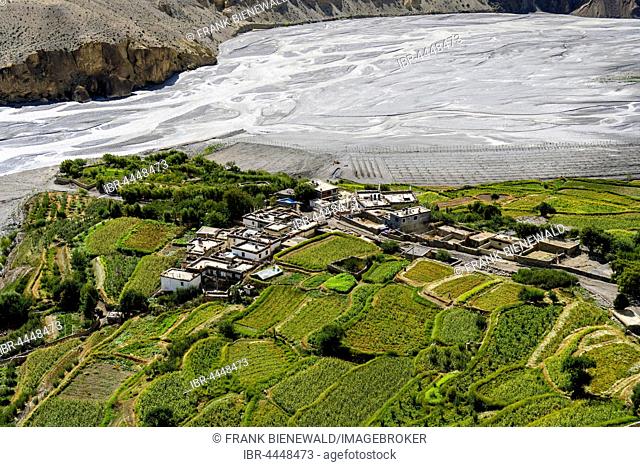 Aerial view of village, Tiri Gompa in Upper Mustang, located on green peninsula in Kali Gandaki valley, Tiri, Mustang District, Nepal