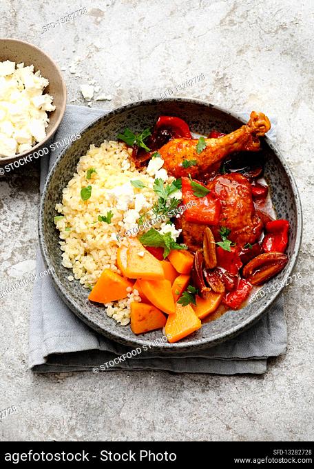 Bulgur wheat bowl with bell pepper and date chicken