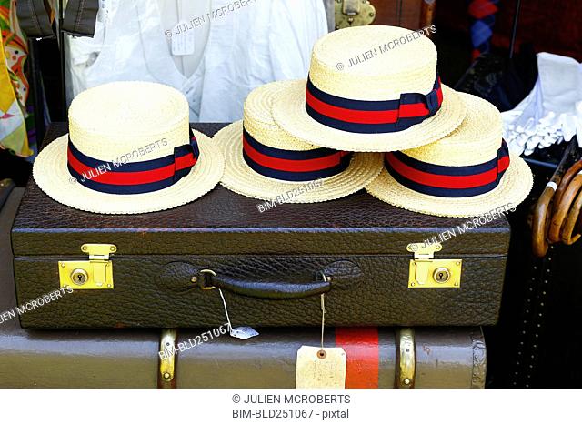 Straw hats on old-fashioned briefcase