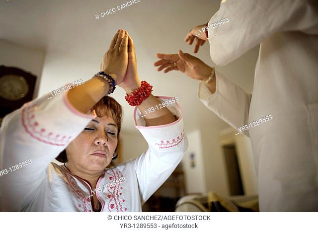 A woman receives Reiki in Mexico City, September 31, 2010  Reiki is a spiritual practice developed in 1922 by Japanese Buddhist Mikao Usui  It uses a technique...