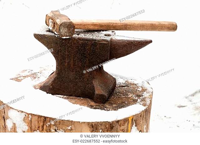 anvil with hammer in old abandoned village smithy