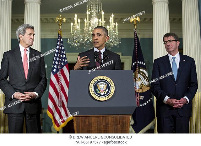 Flanked by United States Secretary of State John Kerry, left, and US Secretary of Defense Ashton Carter, right, US President Barack Obama, center