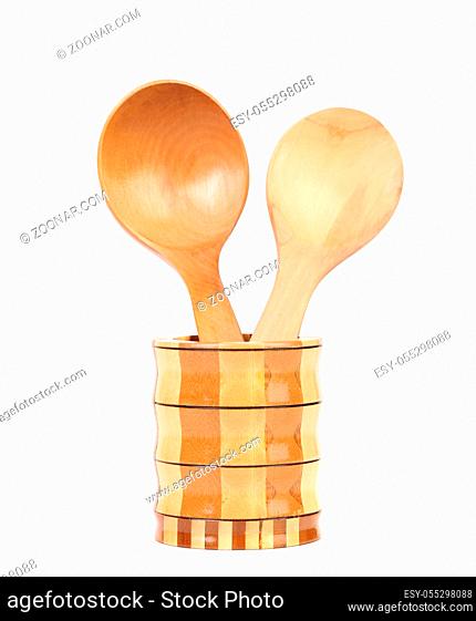 Wooden spoon in jar. Isolated on a white background