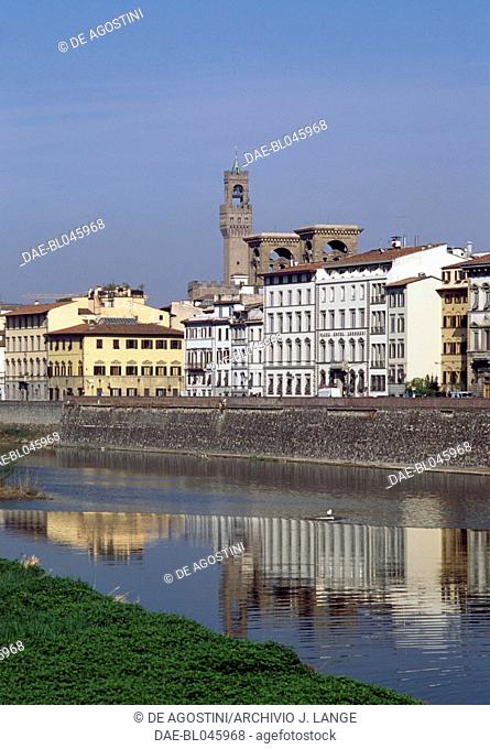 View of the Lungarno (riverside walkway), with the tower of Palazzo Vecchio in the background, Florence (UNESCO World Heritage List, 1982), Tuscany, Italy