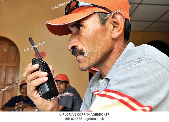 Disaster prevention, early warning system, man with a radio transmitter, Somotillo, Chinandega, Nicaragua, Central America