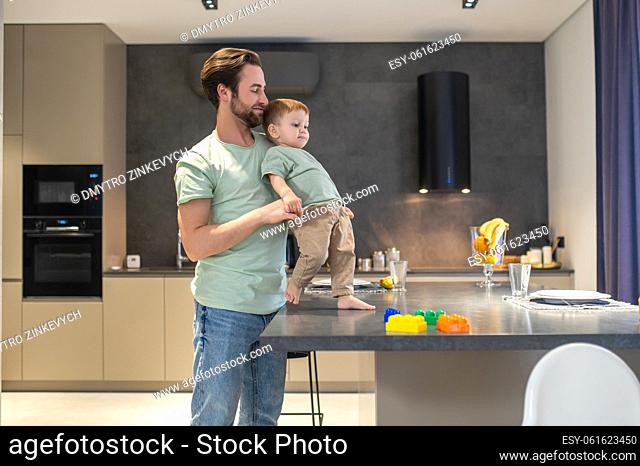 Young family. Dad and son looking happy spending time together
