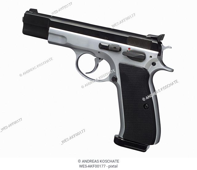Automatic pistol against white background, close up