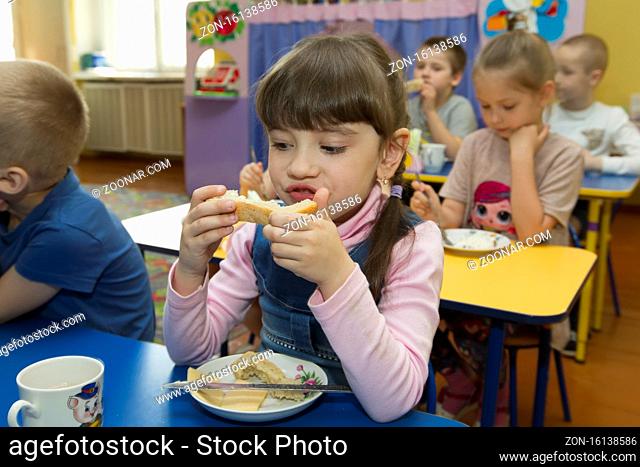 Belarus, the city of Gomel, April 25, 2019. An open day for visitors in kindergarten. Children eats in kindergarten
