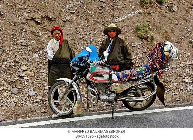 Tibetans with motorcycle, between Gyantse and Dangxiong, Tibet