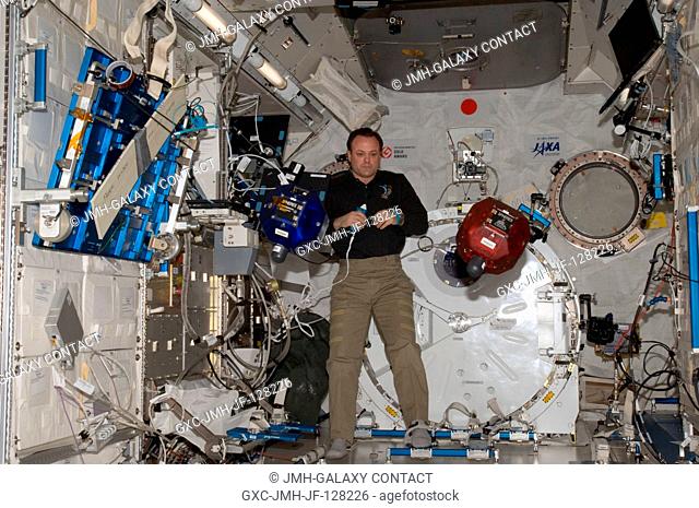 NASA astronaut Ron Garan, Expedition 28 flight engineer, performs a check on Synchronized Position Hold, Engage, Reorient