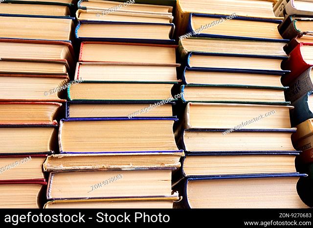 Many old books in a book shop or library, education and reading concept
