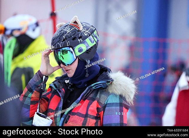 RUSSIA, KABARDINO-BALKAR REPUBLIC - DECEMBER 9, 2023: A snowboarder attends a concert marking the start of the winter season at the Elbrus ski resort