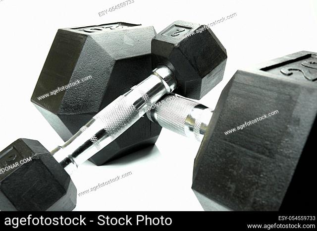 Weight lifting dumbbells isolated against a white background