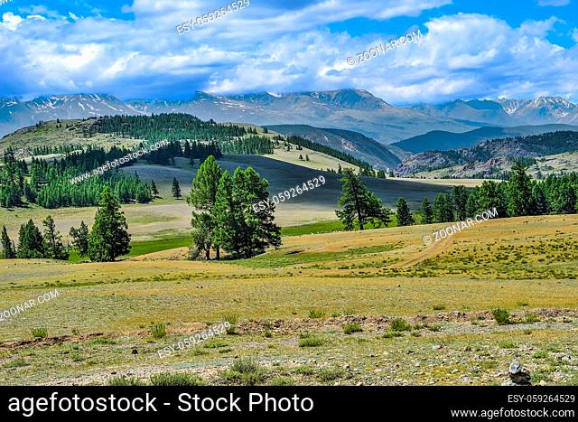 North-Chuya ridge or Severo-Chuiskii range - chain of mountains in Altai republic, Russia - summer mountain landscape with Chuya steppe at foreground and...