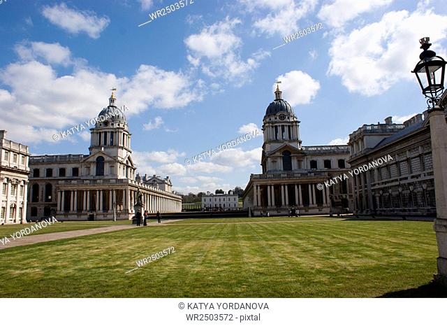 Old Naval College in Greenwich, UK with park and Greenwich Observatory in the background