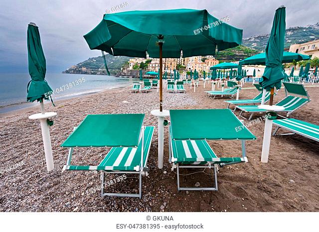 Beach Umbrellas on the Background of the Italian City of Minori