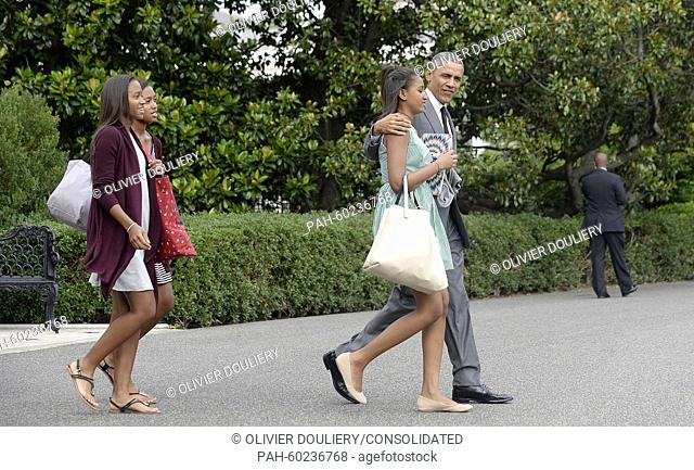 United States President Barack Obama, daughter Sasha and two of Sasha's friends leave the residence to board Marine One at the White House July 17