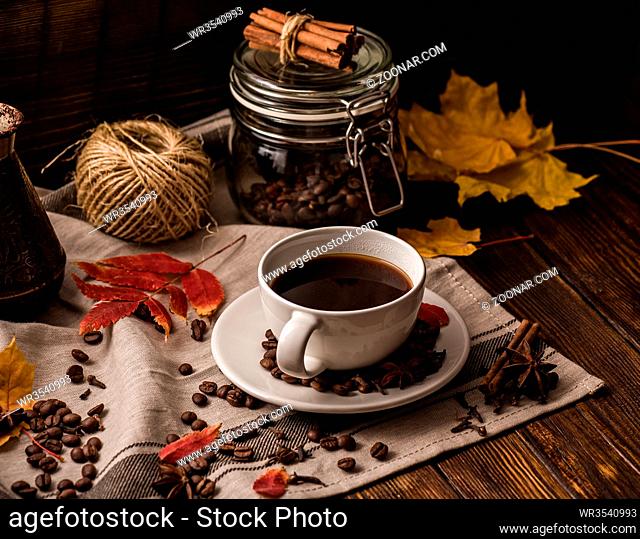 Cup of Coffee with Kitchen Equipment and Spices