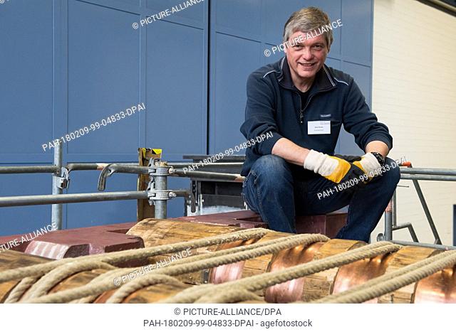 Uwe Dorka, line manager of steel and composite construction at the University of Kassel, sitting next to a true to the original replica of a co-called...