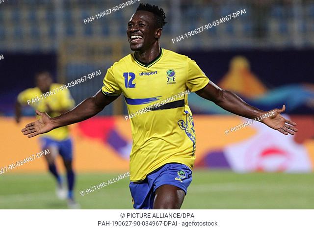 27 June 2019, Egypt, Cairo: Tanzania's Happygod Msuvan celebrate scoring his side's first goal during the 2019 Africa Cup of Nations Group C soccer match...
