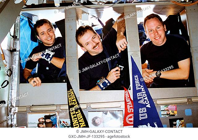 The STS-68 blue shift team members were photographed prior to sleep time in bunk beds aboard the Space Shuttle Endeavour