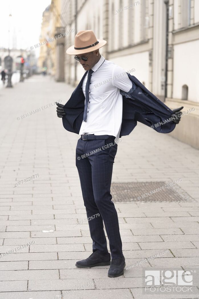 Stock Photo: Fashionable man on the street, Munich, Germany.