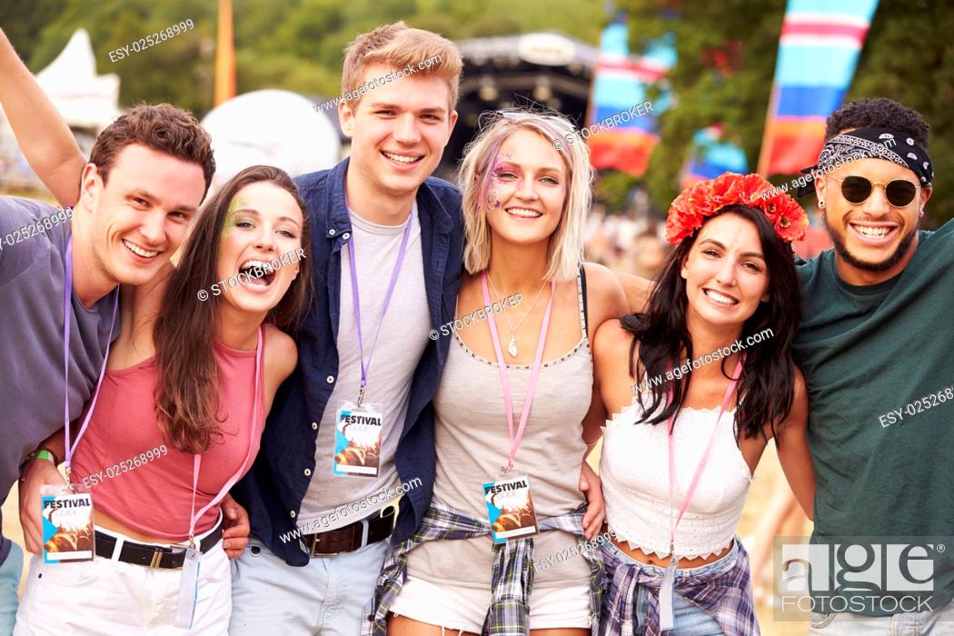 Stock Photo: Group of friends hanging out together at a music festival.