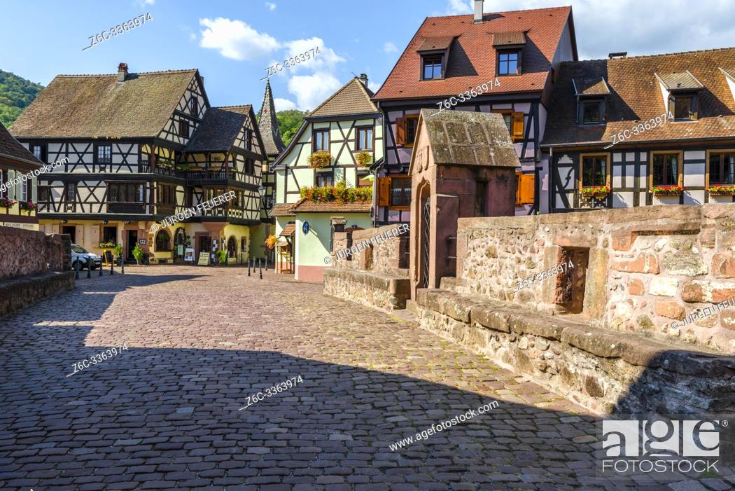 Stock Photo: scenic old town in the center of Kaysersberg, Alsace, France, old town with colorful half-timbered houses and stone bridge.