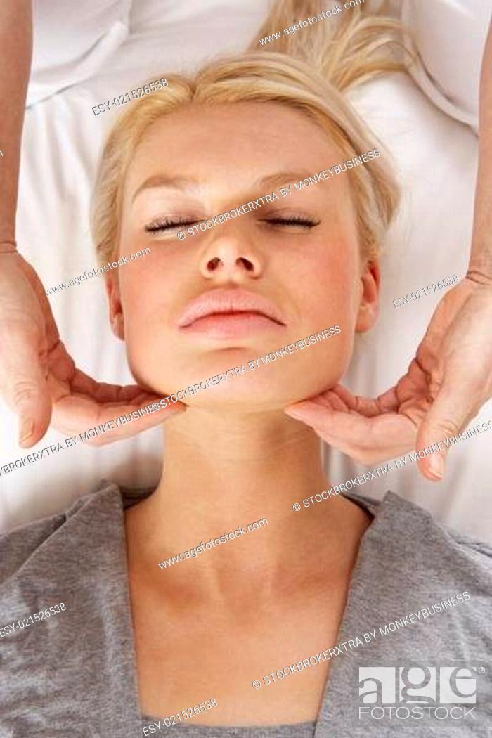 Stock Photo: Woman having Shiatsu massage to head.